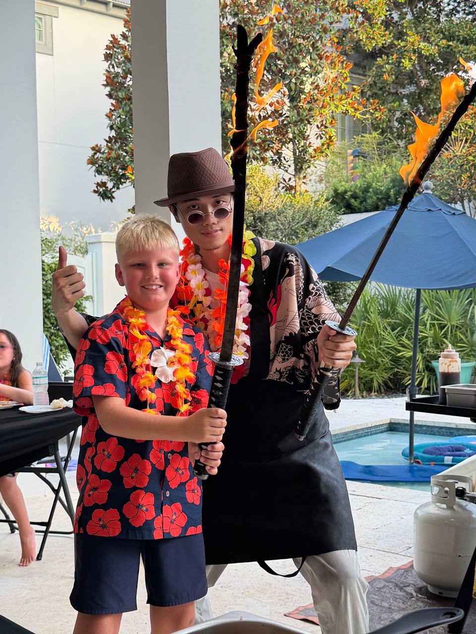 Hibachi fire show performance at backyard party in NW Florida